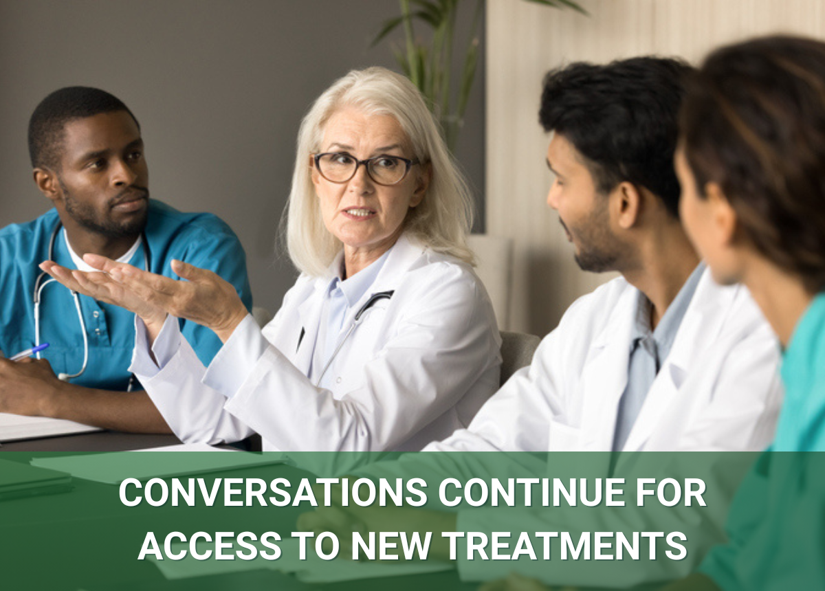 An Image of medicial staff in conversation as conversations continue for access to new treatments